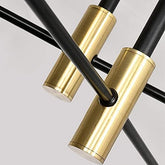 Modern ceiling light fixture with black and gold design on a gray background